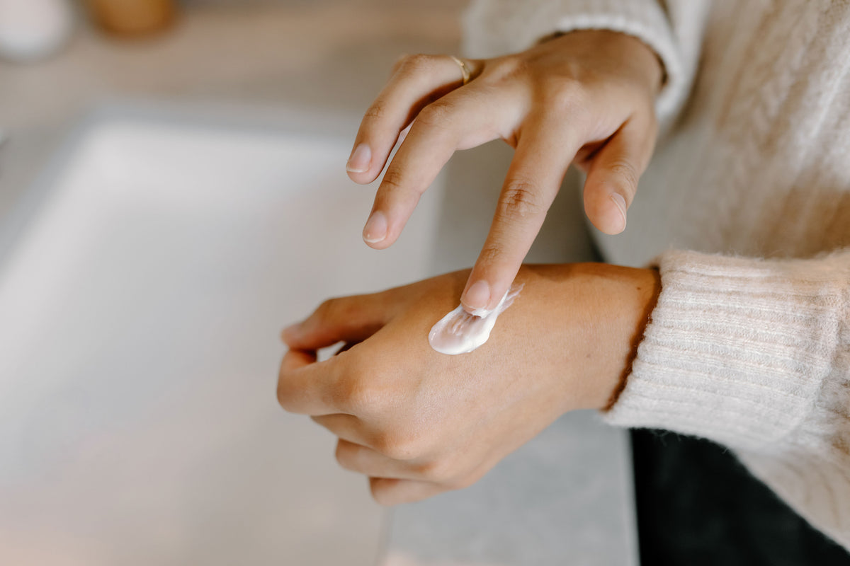 Beauty Balm being applied on hands
